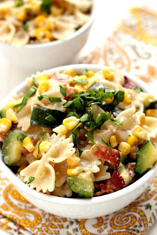 Corn and Zucchini Pasta in a white bowl.