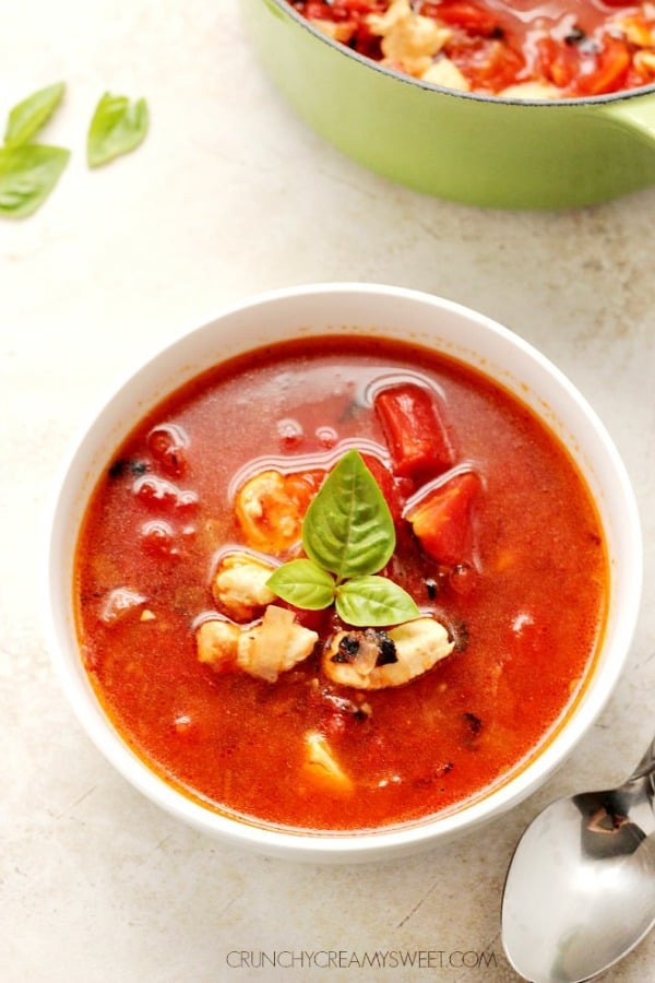 Chipotle chicken soup in a white soup bowl.