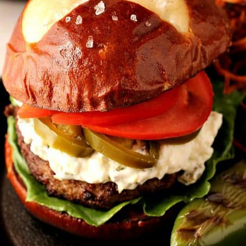 Jalapeno Popper Burger on a skillet.