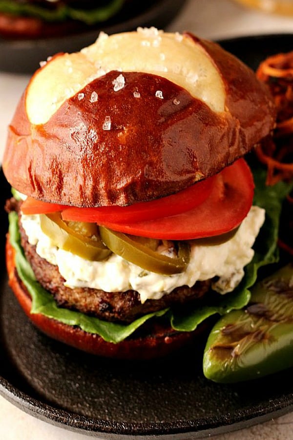 Jalapeno Popper Burger on a skillet.