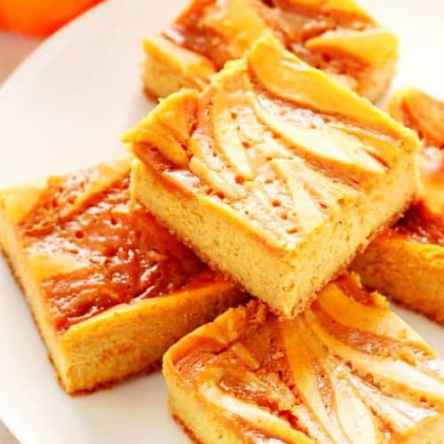 Pumpkin Cheesecake Bars on a white plate.