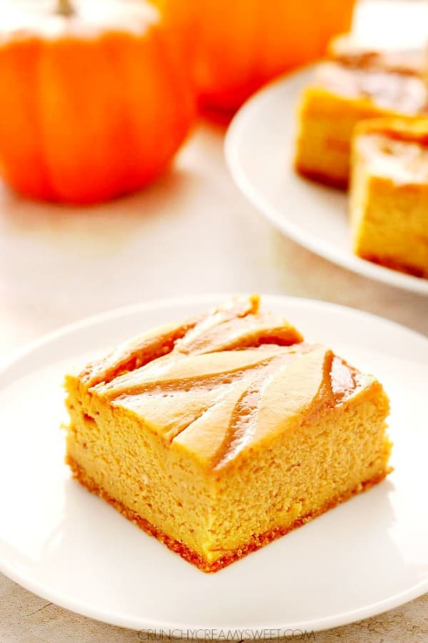 Pumpkin cheesecake bar on a plate.