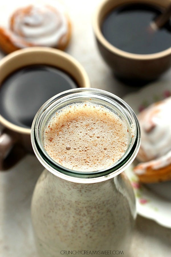 Homemade Cinnamon Roll Coffee Creamer next to coffee.