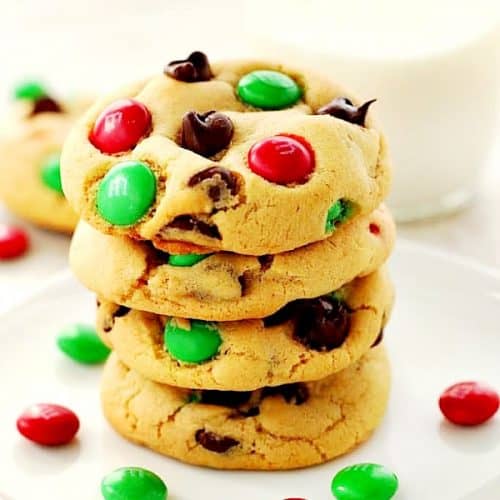 Christmas M&M Cookies stacked on a plate.