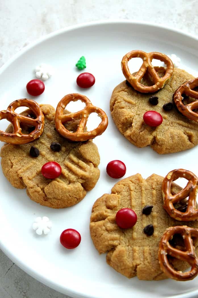 Easy Rudolph the Reindeer Cookies Recipe - easy, fun and adorable! Get kids involved this holiday season and make Rudolph the Reindeer cookies! Check out our video to see how! 