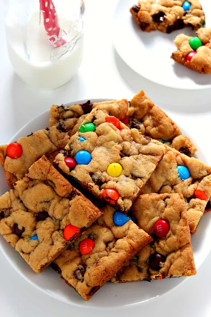 M&M Chocolate Chip Cookie Bars - soft and chewy cookie bars packed with gooey chocolate and bright and colorful M&Ms! All done in under 30 minutes! 