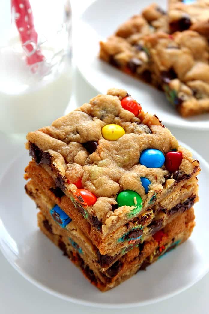 M&M Chocolate Chip Cookie Bars - soft and chewy cookie bars packed with gooey chocolate and bright and colorful M&Ms! All done in under 30 minutes! 