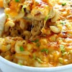 Queso mac and cheese in white baking casserole dish.