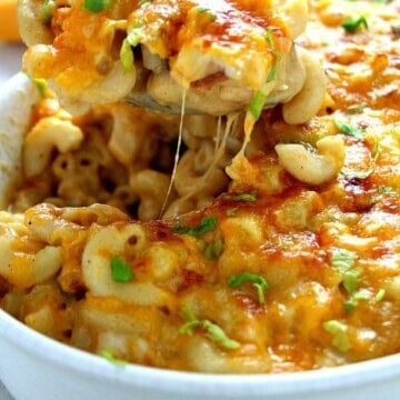 Queso mac and cheese in white baking casserole dish.