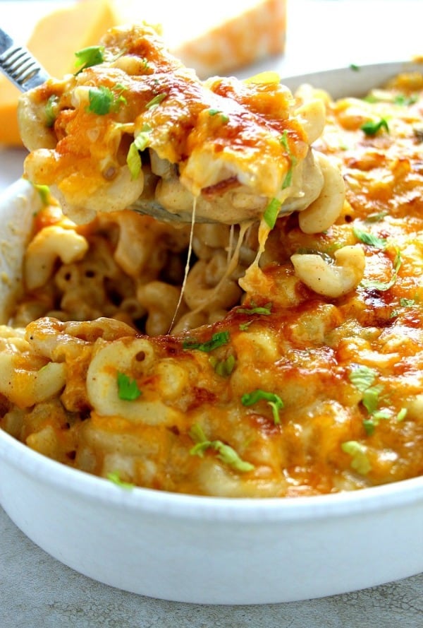 Queso mac and cheese in white baking casserole dish.