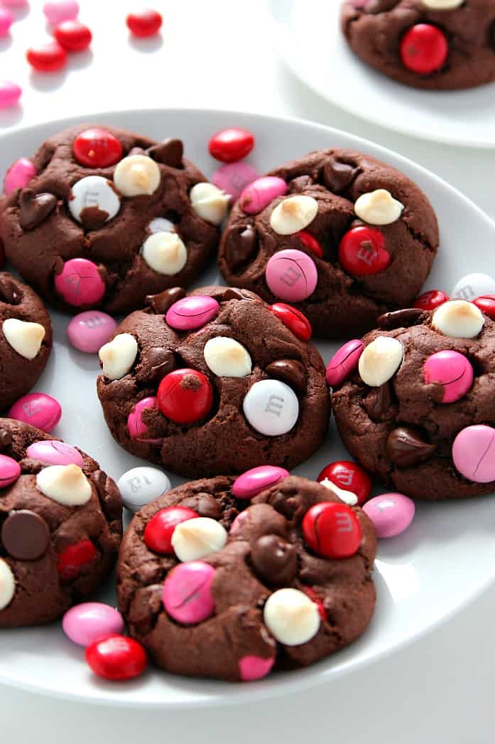 Double Chocolate M&M Cookies Recipe - soft and chewy pudding cookies packed with cocoa powder, semi-sweet chocolate chips, white chocolate chips and bright red and pink M&M's! Make a batch and bake it - all in 30 minutes! 