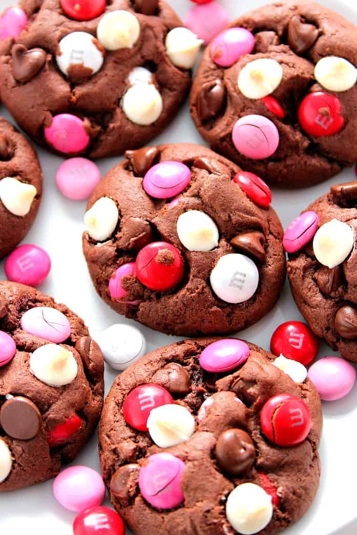 Double Chocolate M&M Cookies Recipe - soft and chewy pudding cookies packed with cocoa powder, semi-sweet chocolate chips, white chocolate chips and bright red and pink M&M's! Make a batch and bake it - all in 30 minutes! 