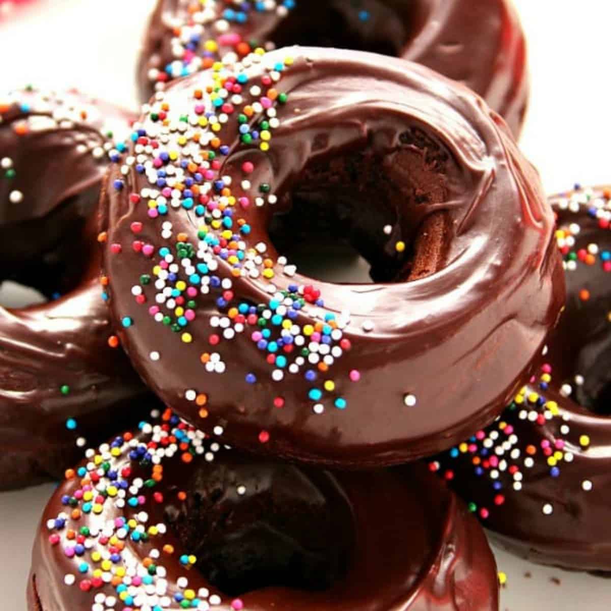 Chocolate donuts on a plate.