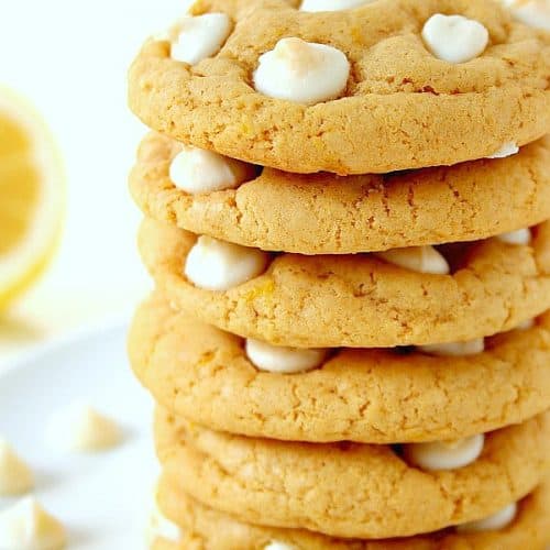Lemon White Chocolate Chip Cookies stacked on a plate.