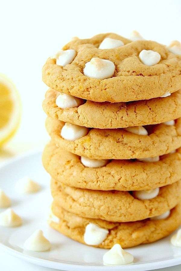 Lemon White Chocolate Chip Cookies stacked on a plate.