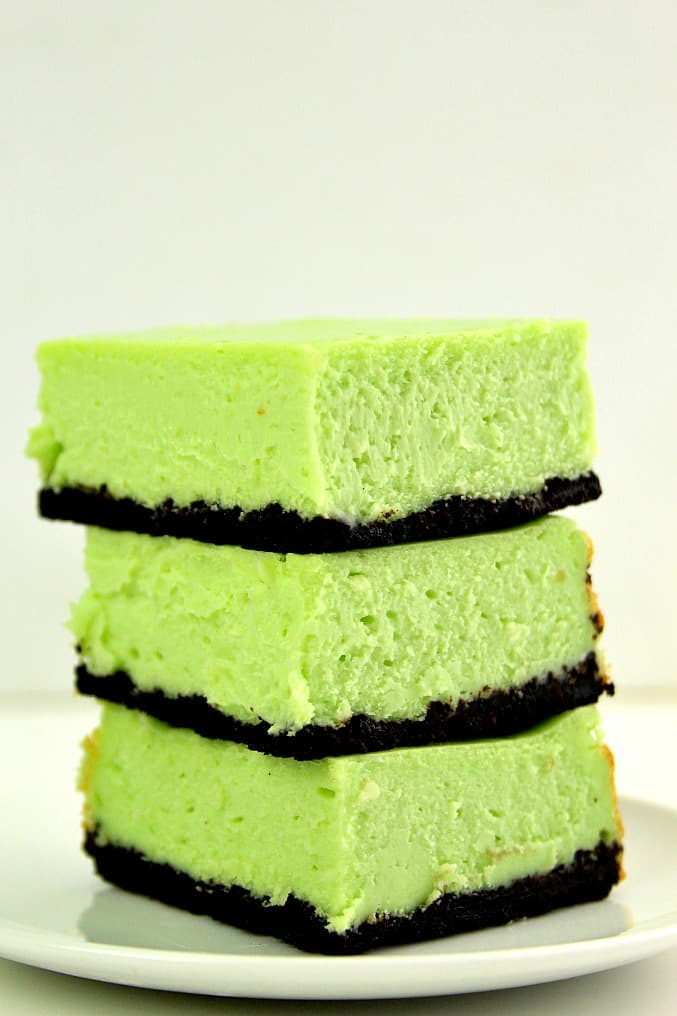 Mint Cheesecake Bars Recipe - thick and creamy cheesecake bars with refreshing mint flavor and chocolatey Oreo crust. So easy, you will love each and every bite! 