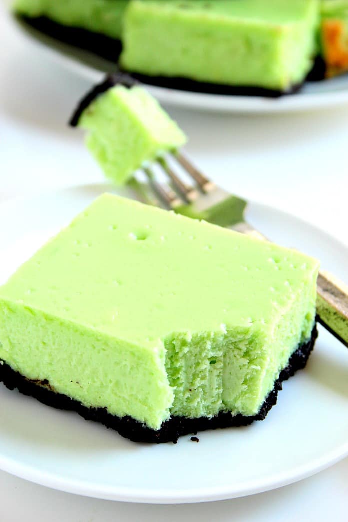 Mint Cheesecake Bars Recipe - thick and creamy cheesecake bars with refreshing mint flavor and chocolatey Oreo crust. So easy, you will love each and every bite! 