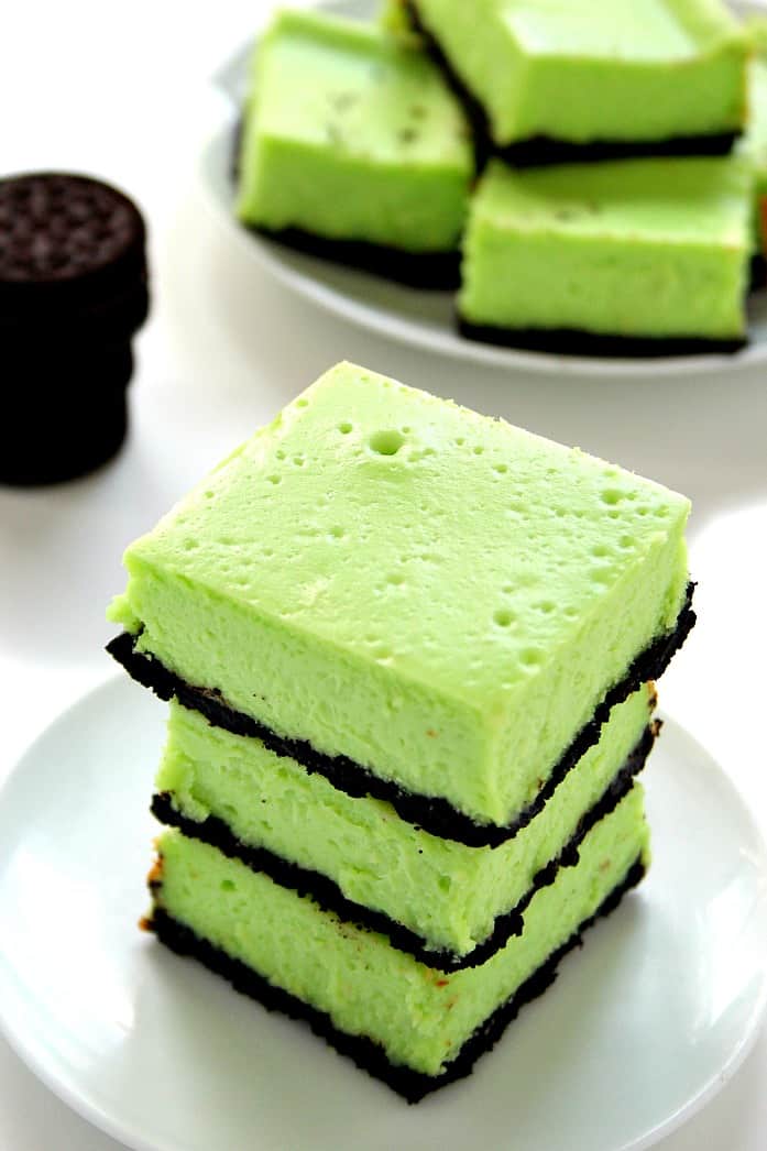 Mint Cheesecake Bars Recipe - thick and creamy cheesecake bars with refreshing mint flavor and chocolatey Oreo crust. So easy, you will love each and every bite! 