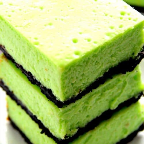 Mint Cheesecake Bars stacked up.