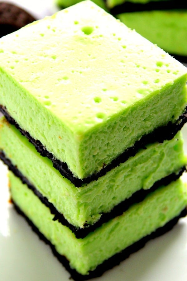 Mint Cheesecake Bars stacked up.