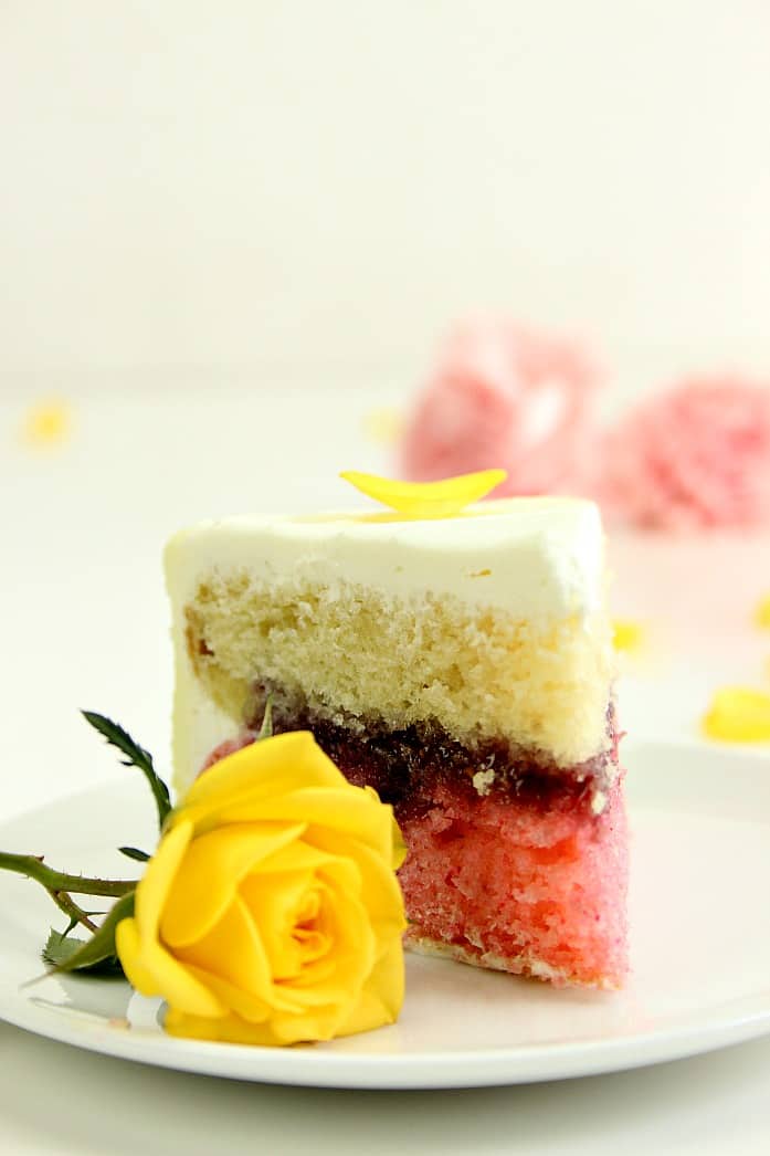 Lemon Raspberry Ombre Layer Cake - gorgeous tiered layer cake with ombre frosting and fresh flowers. Easy yet impressive and perfect for a special occasion. 