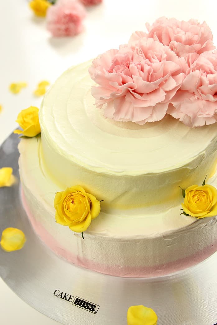 Lemon Raspberry Ombre Layer Cake - gorgeous tiered layer cake with ombre frosting and fresh flowers. Easy yet impressive and perfect for a special occasion. 