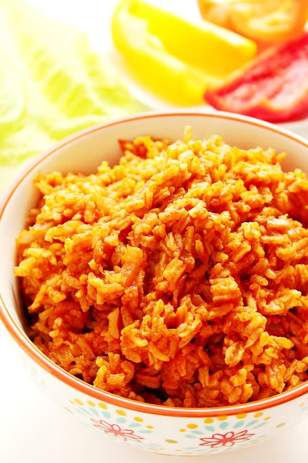 Spanish rice in a bowl with red rim.