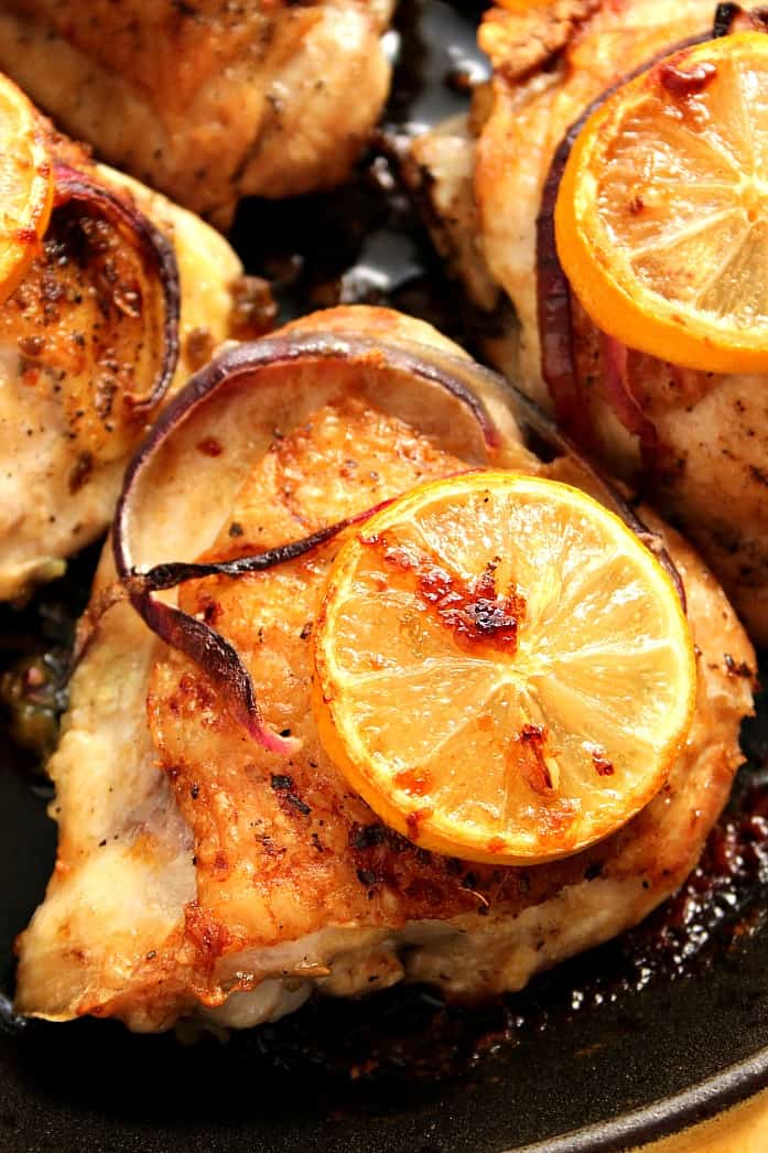 Lemon Garlic Roasted Chicken Thighs in cast iron skillet. 