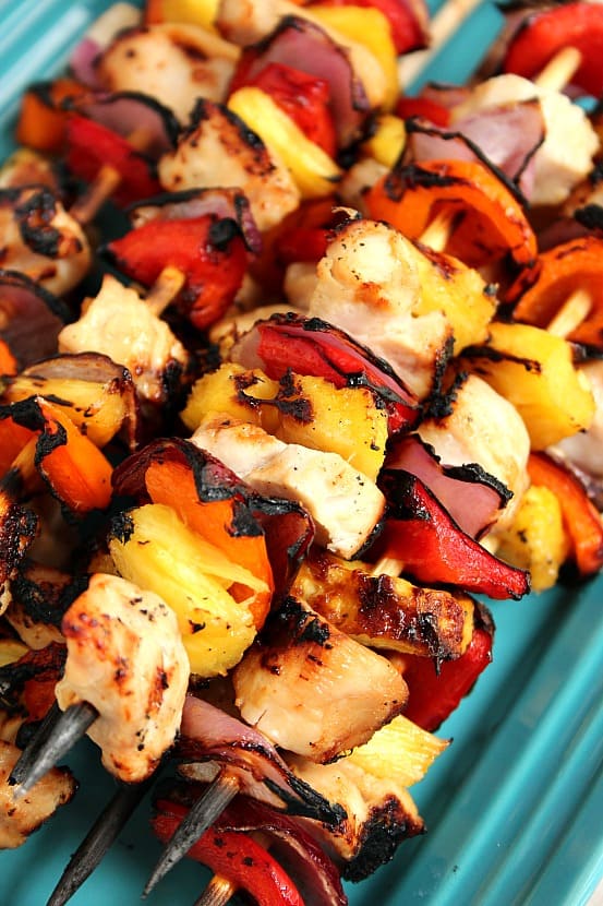 Pineapple Chicken Kabobs recipe - sweet and sour marinated chicken, colorful bell peppers, sweet red onion and juicy pineapple make these kabobs a great quick and easy summer dinner idea! 