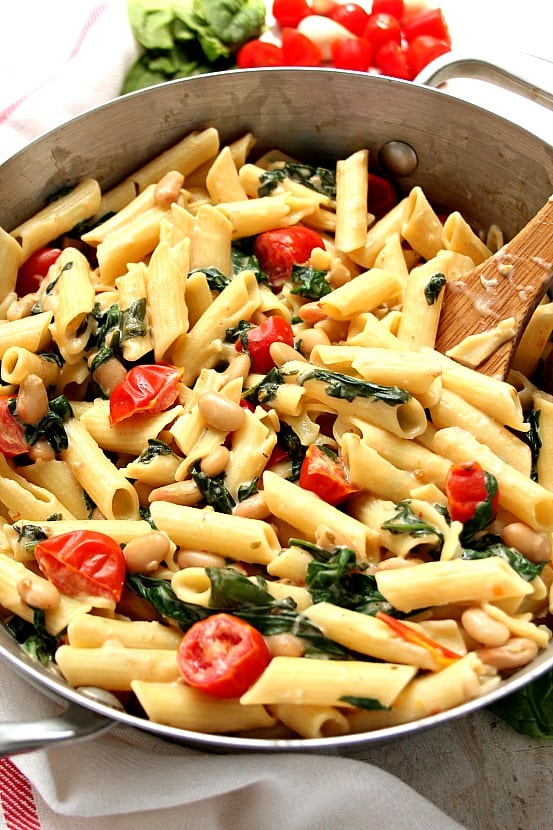 Pasta and vegetables in skillet.