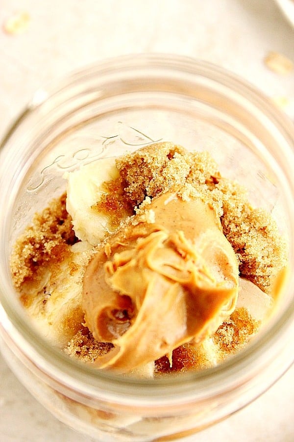 Overhead shot with peanut butter and brown sugar in glass jar.