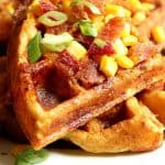 Cheddar Bacon Cornbread Waffles on a plate.