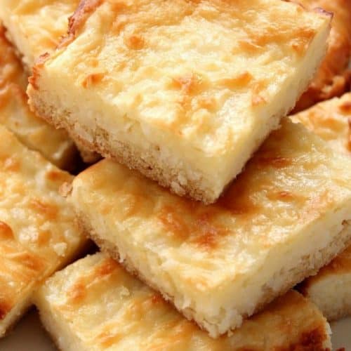 Coconut Cheesecake Bars on plate.