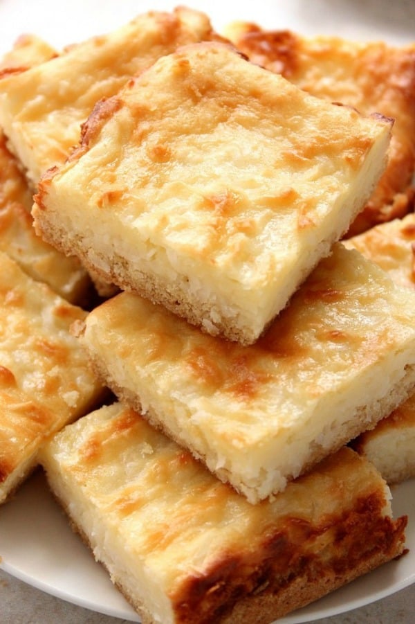 Coconut Cheesecake Bars on plate.