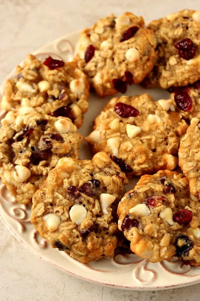 Cranberry White Chocolate Oatmeal Cookies Recipe - chewy oatmeal cookies filled with dried cranberries and white chocolate chips! It's quick and easy to make a batch and enjoy with a glass of milk!