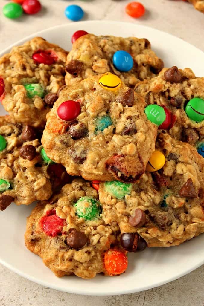 Oatmeal cookies with chocolate chips and M&M's on plate.