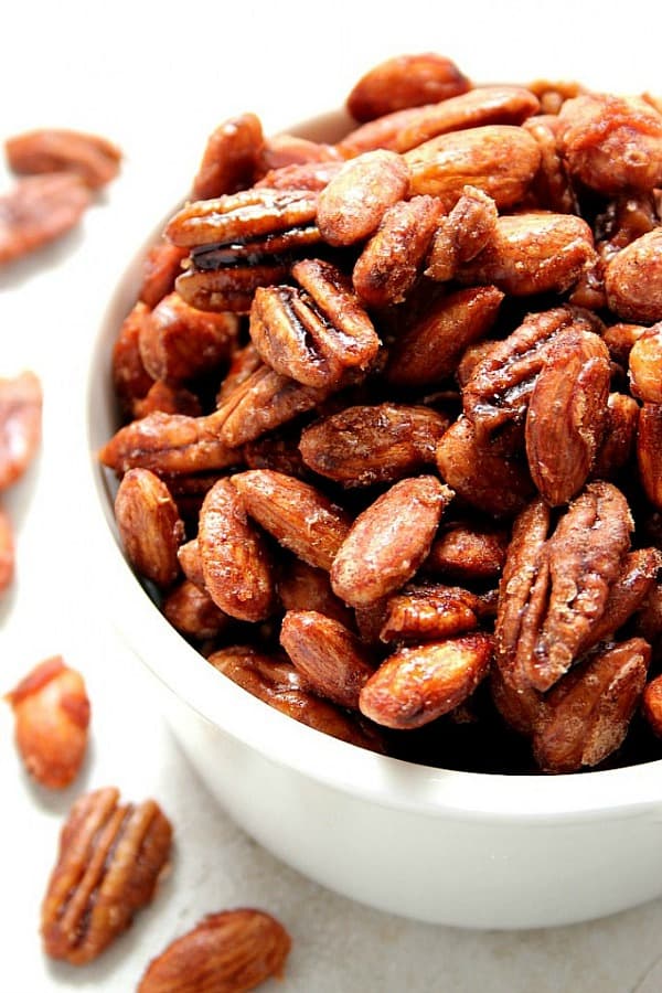 Crock-Pot® Candied Spiced Nuts - the best and easiest candied nuts recipe. No egg white needed! Just mix and cook in a slow cooker. Crockpot Candied Spiced Nuts in a bowl.