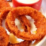 Onion rings with dipping sauce.