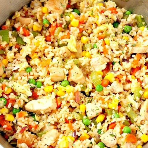 Fried rice in stainless steel skillet.