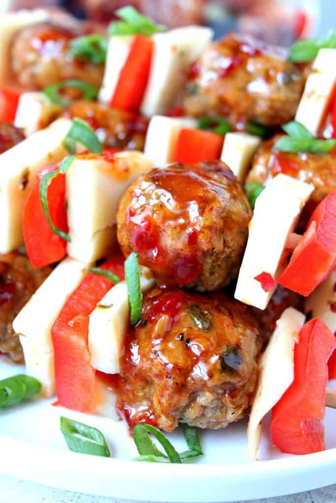 Sweet and Spicy Chicken Meatball Kebobs Recipes - fun way to serve spicy chicken meatballs glazed with sweet chili sauce. Bright and colorful appetizer for your next party! 
