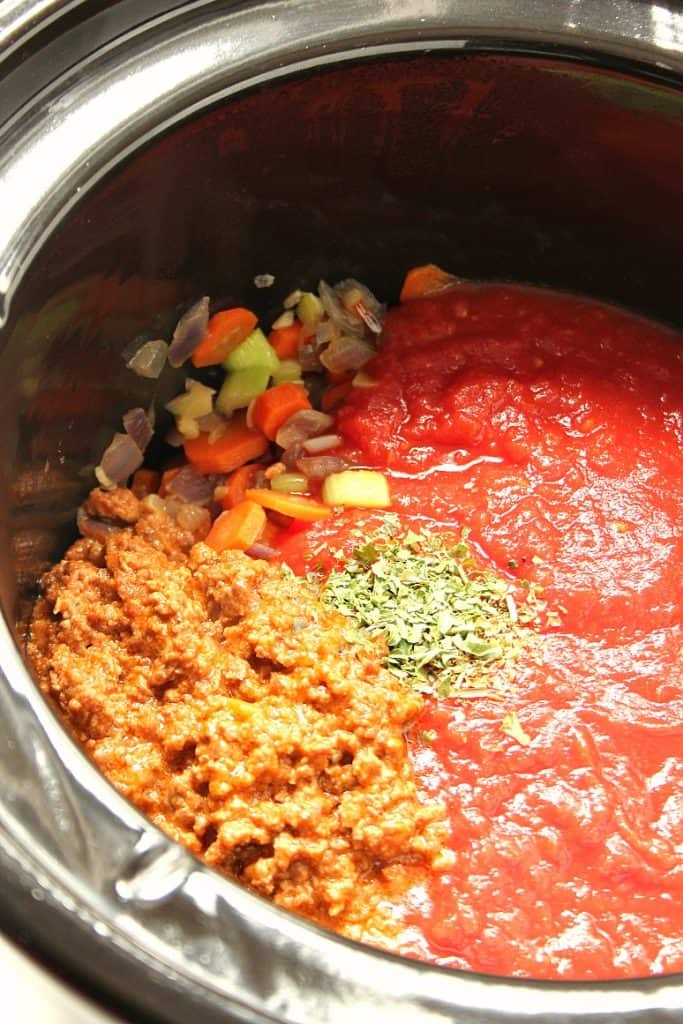 Ingredients for bolognese sauce in slow cooker.