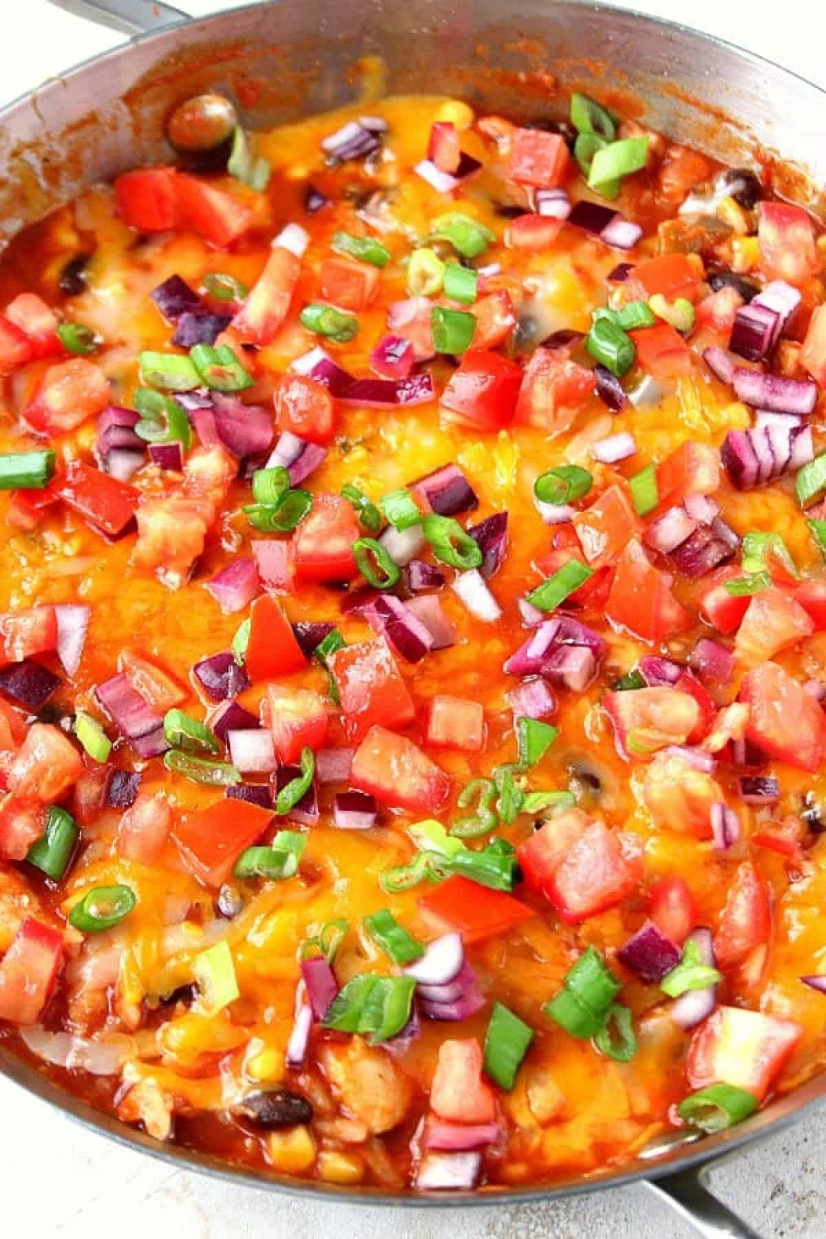 Mexican chicken and rice skillet Chicken and rice dinner in a deep pan.