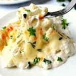 Cheesy Cauliflower Alfredo Bake on plate with fork.