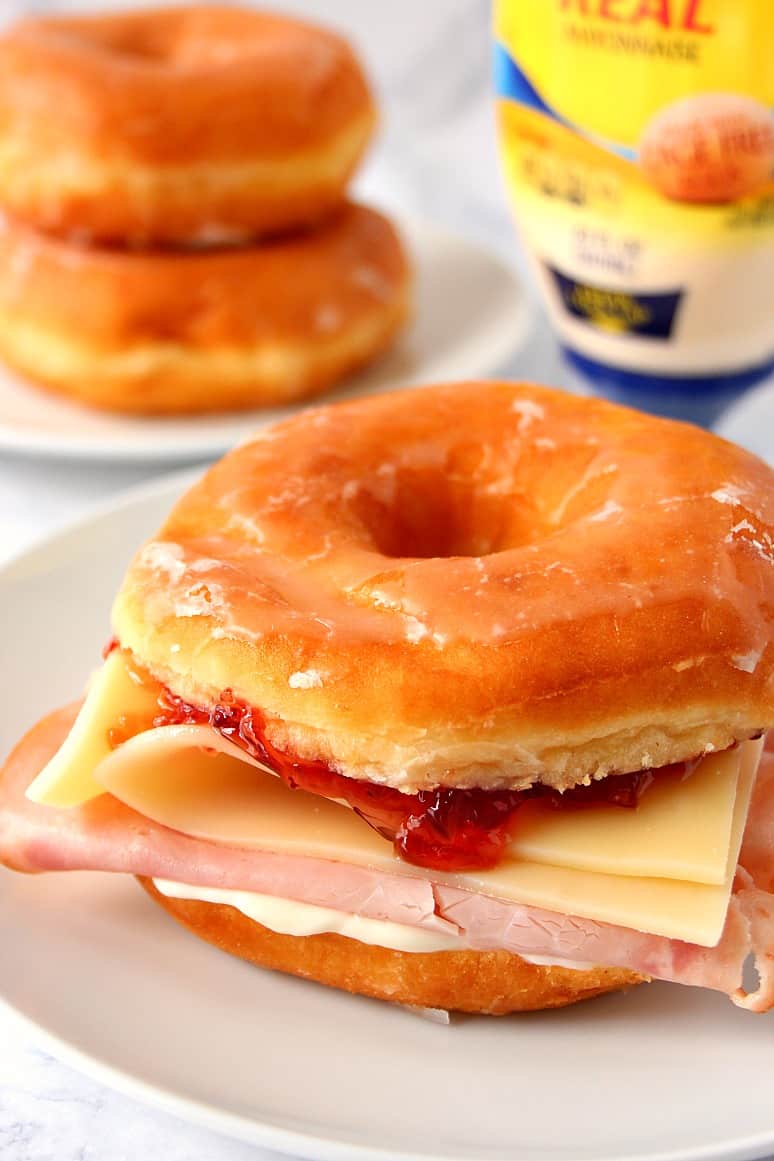 Donut Monte Cristo Sandwich Recipe - fresh from the bakery glazed donut with honey smoked ham, mayo, Swiss cheese and red currant jelly make for a strange but delicious combination! 