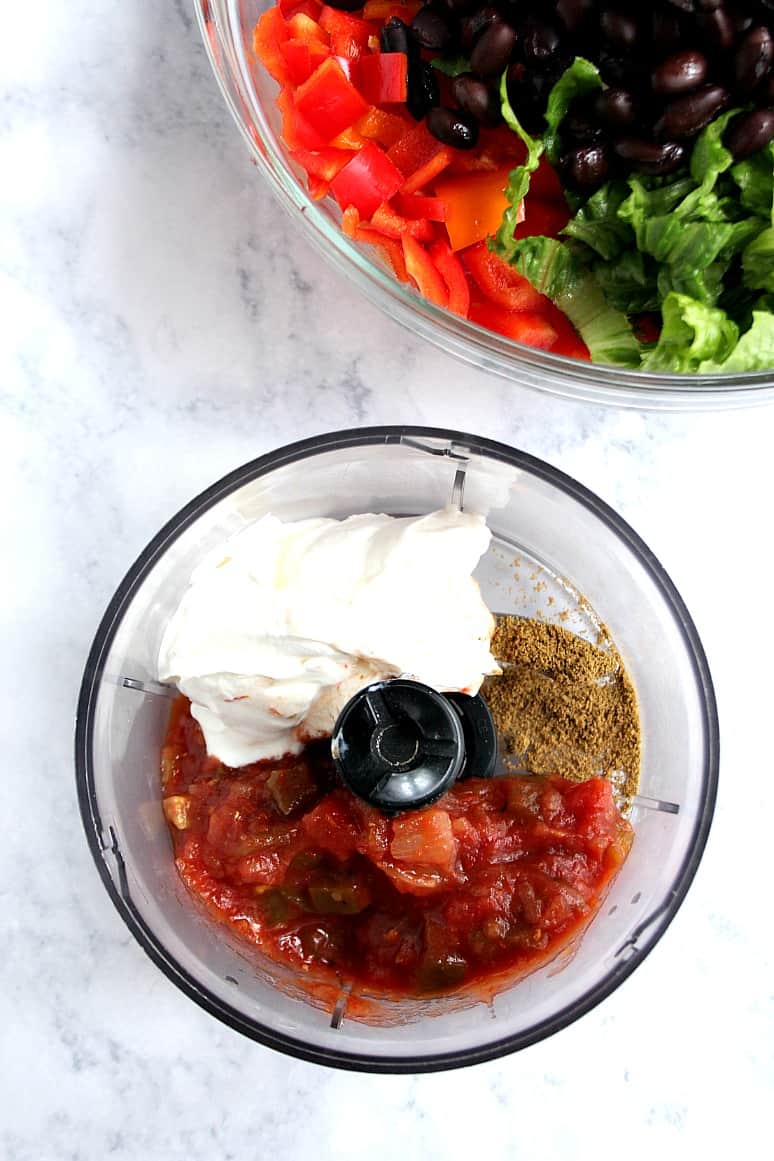 Black Bean Taco Salad Recipe - lighter version of the classic taco salad. Packed with vegetables and black beans in place of chicken for protein. The dressing is simply irresistible!