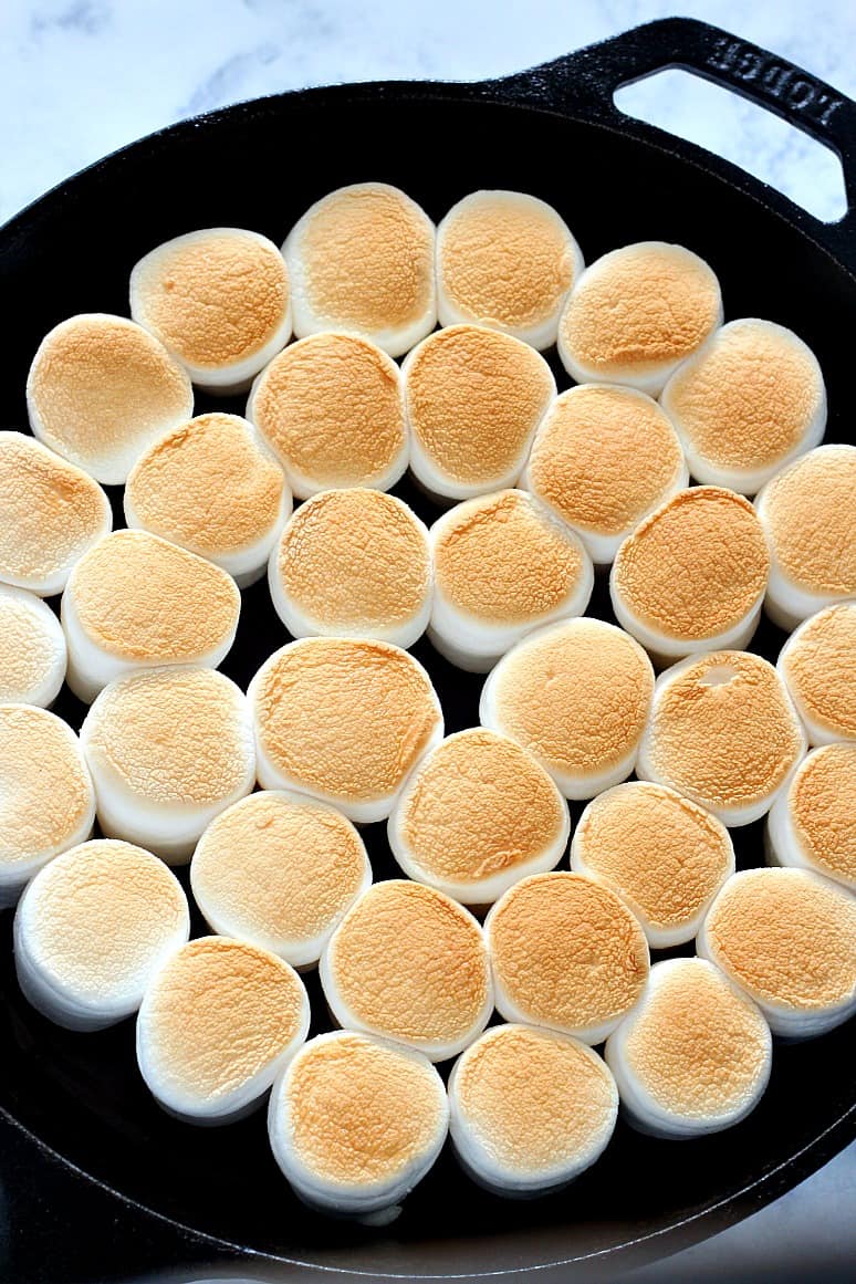 Overhead shot of toasted marshmallows in the s'mores dip. www.crunchycreamysweet.com