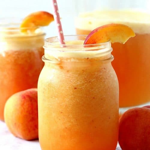 Peach Aqua Fresca in mason jar with straw.