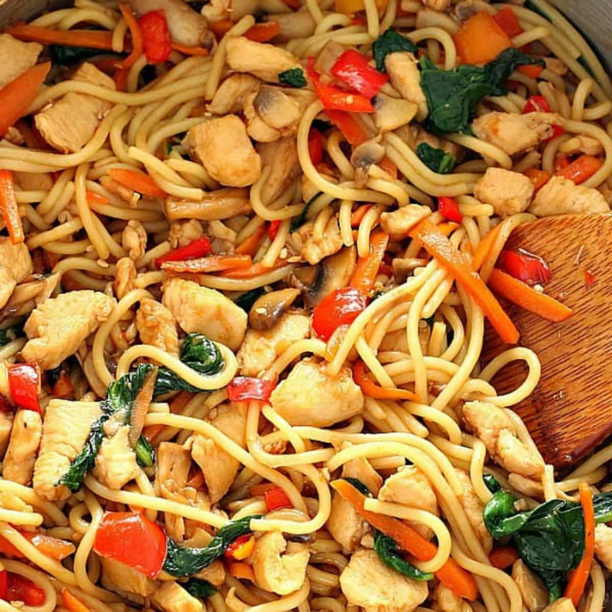 Chicken with noodles in a pan.