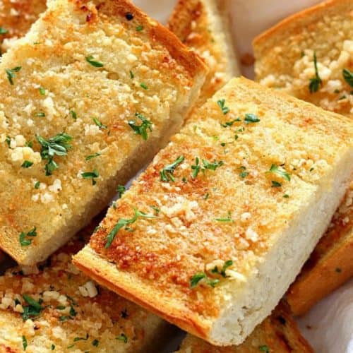 Garlic bread slices in a basket.