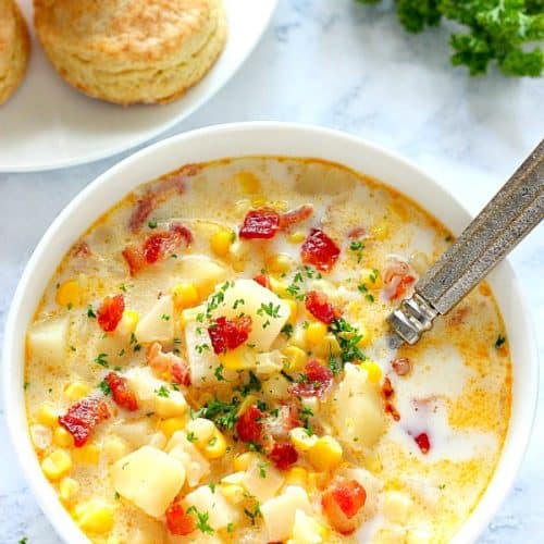 Instant Pot corn chowder in a bowl with spoon.